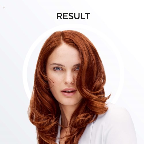 En kvinna med rött hår och ljus hy ser självsäker ut, med ordet "RESULT" ovanför hennes huvud.