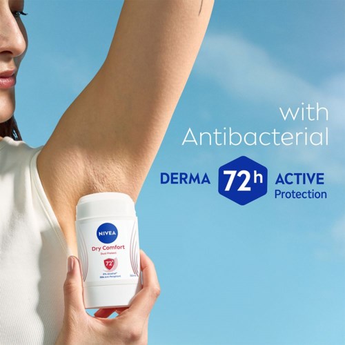 A person holding a NIVEA deodorant against their armpit with sky background, promoting antibacterial protection for 72 hours.