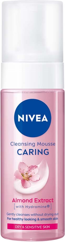Vaaleanpunainen Nivea puhdistusvaahto pullo, merkattu hoitava ja sisältää manteliuutteen herkälle iholle.