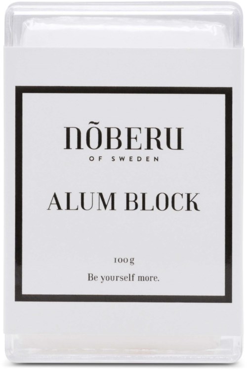 Eine weiße Verpackung von Aluminiumbarren-Seife mit schwarzem Text und Rahmen, gekennzeichnet mit "NÖBERU", "ALUM BLOCK" und "Be yourself more.".