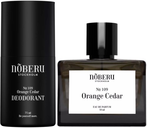 Deodorant and perfume bottles from Näberu, Stockholm in orange cedar scent, black packaging and white label.
