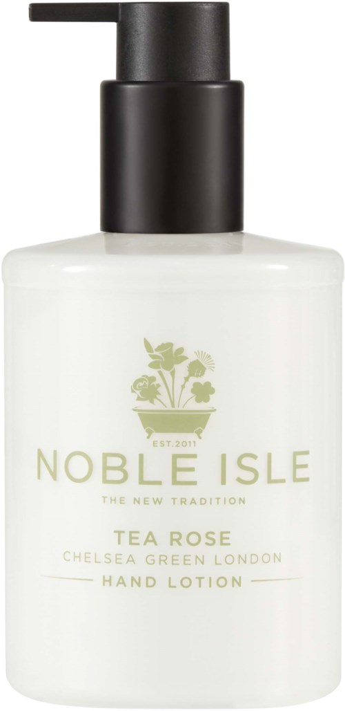 A white bottle with a black pump, labeled Noble Isle tea rose hand lotion, featuring a green plant logo.