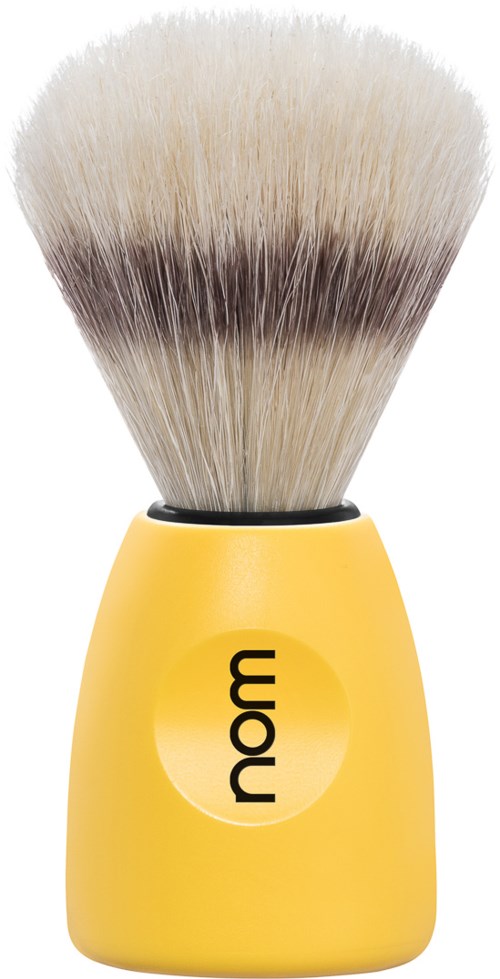 A yellow shaving brush with a black handle and soft bristles.