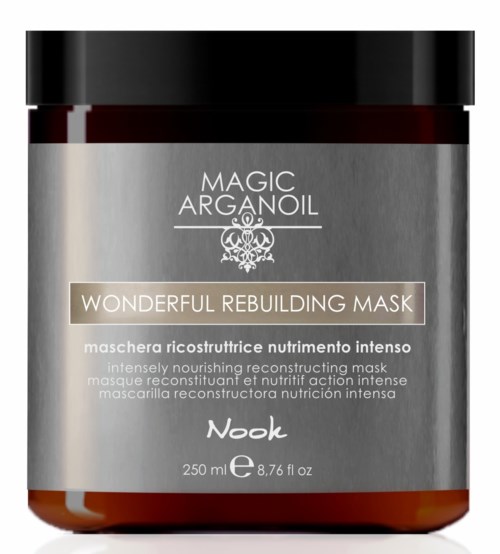 En burk med Magic Arganoil Wonderfull Rebuilding Mask med svart lock och silverfärgad etikett. Etiketten har text som beskriver produkten.