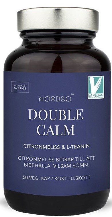 Donkere fles met zilveren dop, label 'Double Calm' met groen-wit veganlogo en ingrediënten lijst.