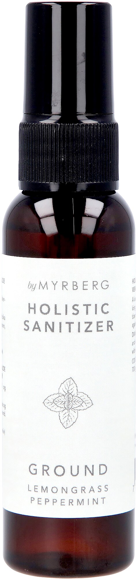 En liten brun flaske med svart sprayhode, merket med hvit etikett for helhetlig desinfeksjon med sitrongress og peppermynte.
