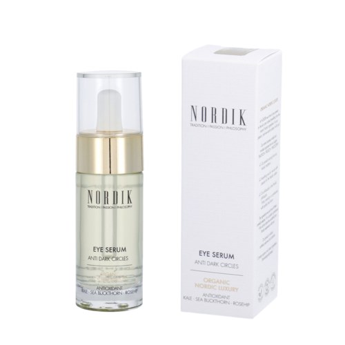 En hudvårdsproduktflaska och förpackning märkt 'Nordik Eye Serum Anti Dark Circles' med guld och vitt design.