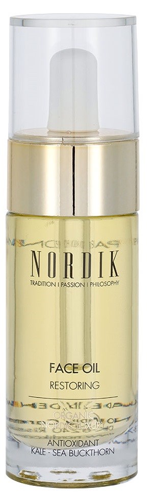 En flaska ansiktsolja märkt Nordik Restoring, innehåller antioxidant som grönkål och havtorn, med pumpbehållare.