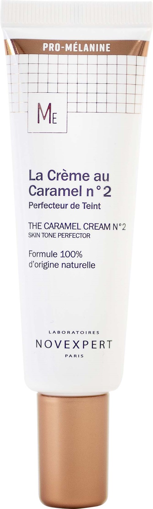 En hvid og gylden tube med karamelfarvet hudcreme fra Novexpert, med tekst og gitter på emballagen.