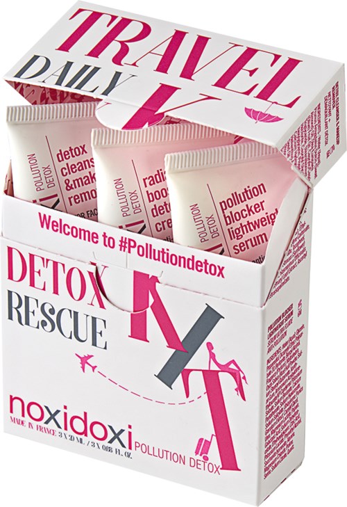 En eske viser detox- og forurensningsbekjempende produkter med rosa og grå tekst og illustrasjoner, som fremmer helse og renslighet.