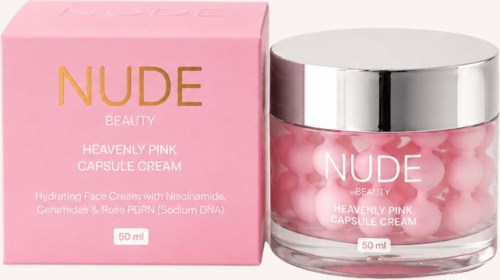 En rosa eske og krukke med NUDE Heavenly Pink Capsule Cream med rosa kapsler inni, for ansiktshudpleie.