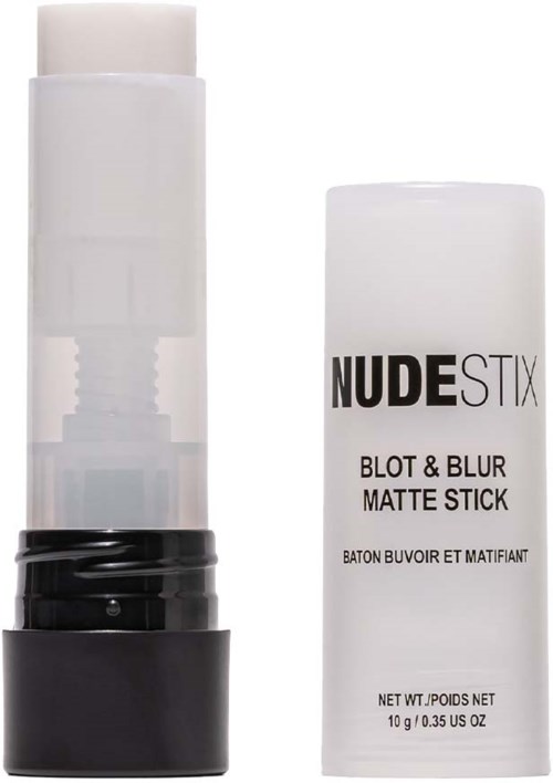 En vit cylindrisk pinne med svart bas, märkt NUDE STIX Blot & Blur Matte Stick.