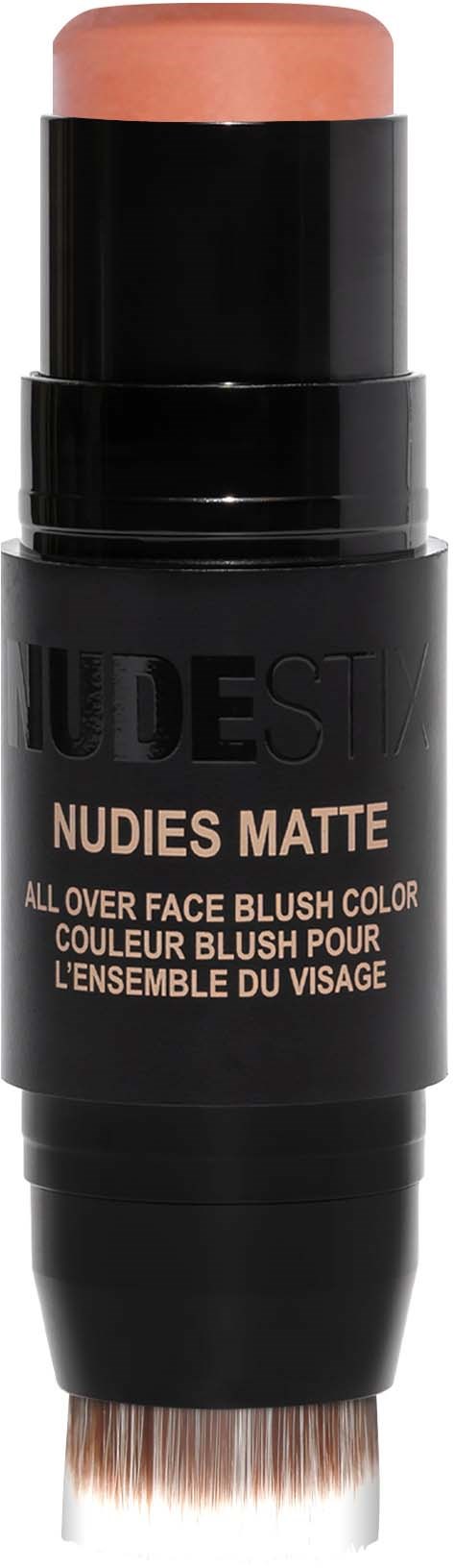 Ein schwarzer Stick mit abgerundetem Kopf, beschriftet 'NUDES MATTE' für Gesichtspuder, mit Pinsel am unteren Ende.