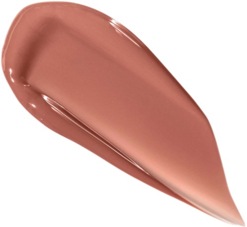 Kremaktig peachfarget sminkeprøve med glatt, blank overflate og spiss form.