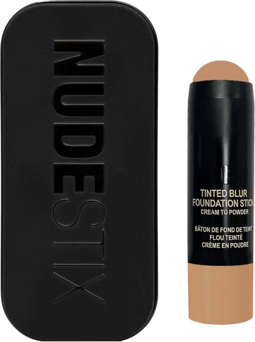 Eine schwarze Make-up-Box mit 'XESTEST' und ein beiger Stick-Foundation mit schwarzem Deckel und Beschriftung.