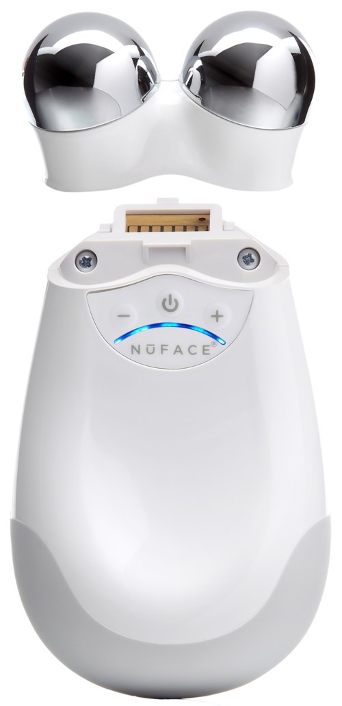 A white device with a large rounded body, control buttons, and two shiny silver balls on top, likely a beauty or skincare tool.