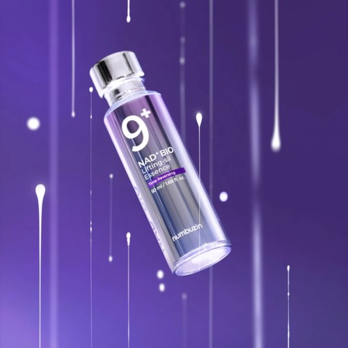 A small clear bottle with purple label floats against a purple background with white streaks. The label has text and a logo.