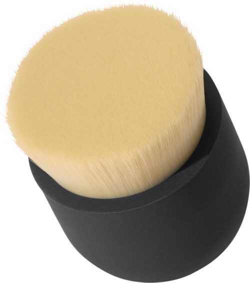A makeup brush with soft yellow bristles and a black handle, viewed from above.
