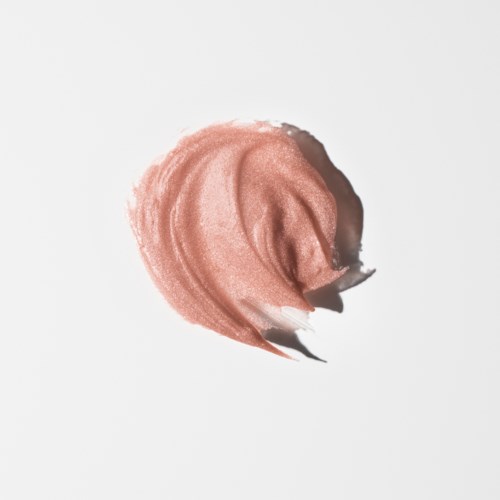 A swatch of pinkish-beige makeup or lipstick with a soft, creamy texture on a white background.