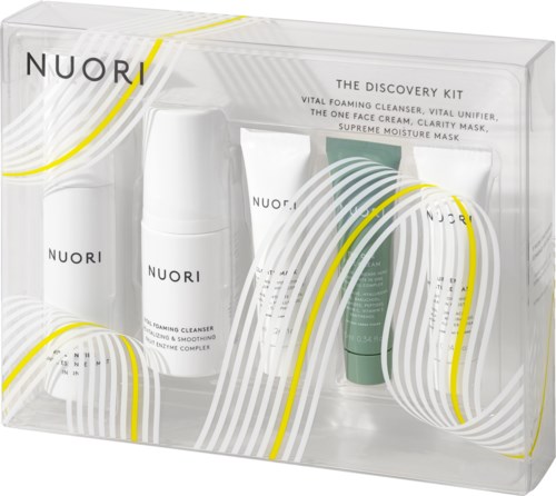 A clear box with three skincare products: a foaming cleanser, a face cream, and a moisturizer, labeled NUORI.