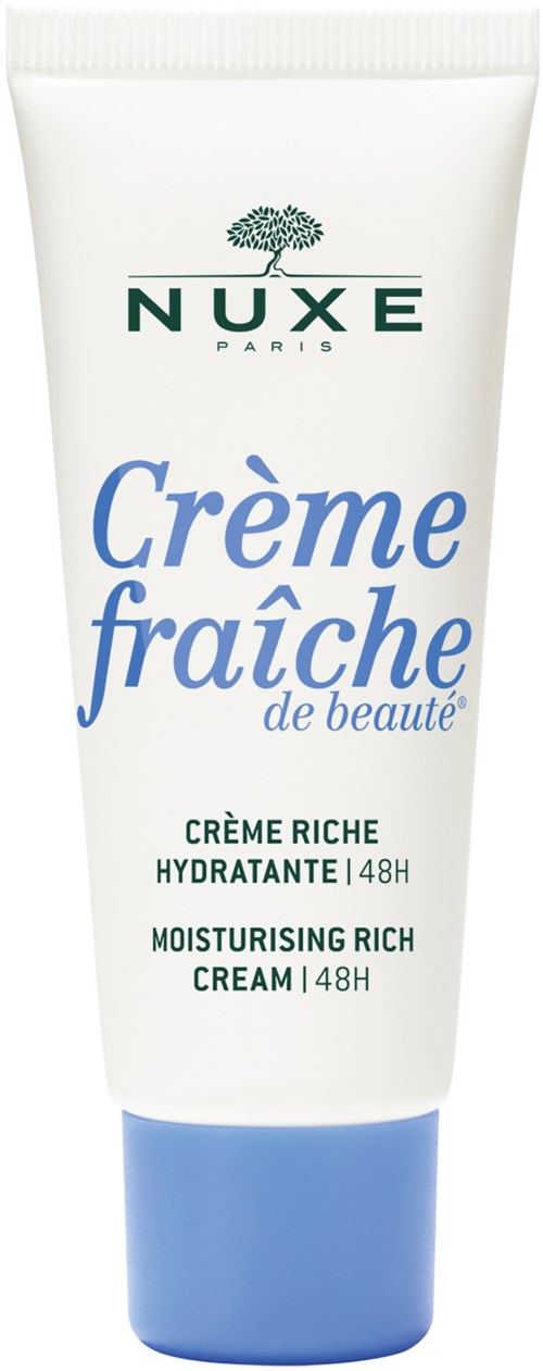 Een witte tube met NUXE hydraterende crème, gemarkeerd in blauw en groen, met een blauwe dop en een boomlogo.