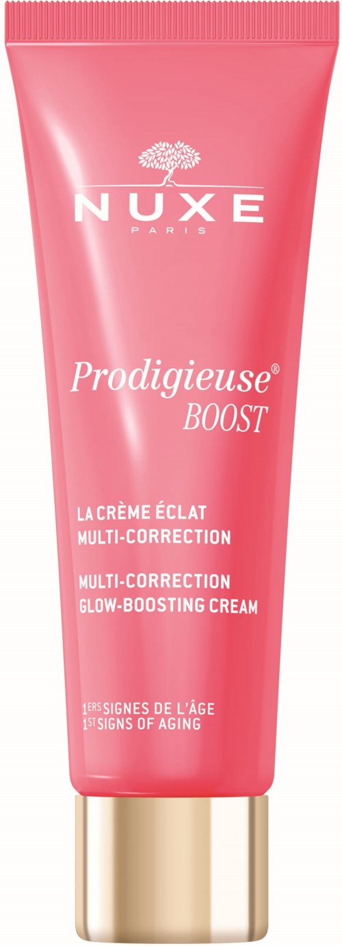Pink tube med NUXE Prodigieuse Boost ansiktskrem med gullhette, merket for flere korrigeringer og tegn på alder.