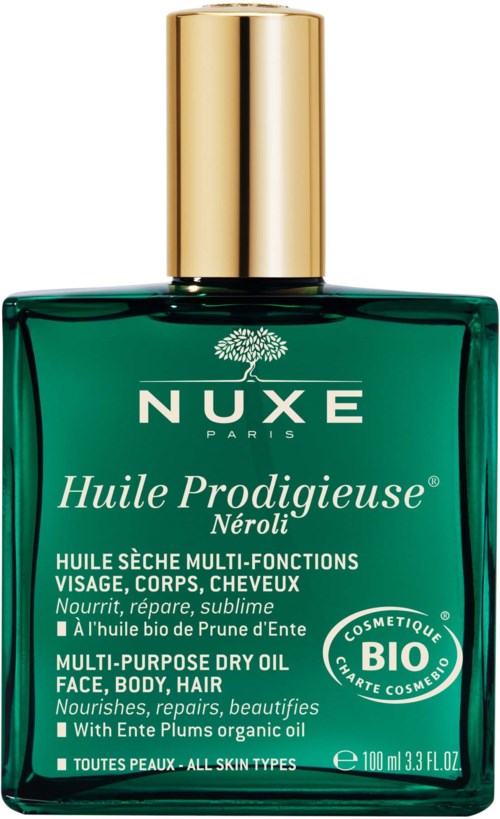 En grønn flaske med gullhette, merket NUXE Huile Prodigieuse Neroli, for ansikt, kropp og hår.
