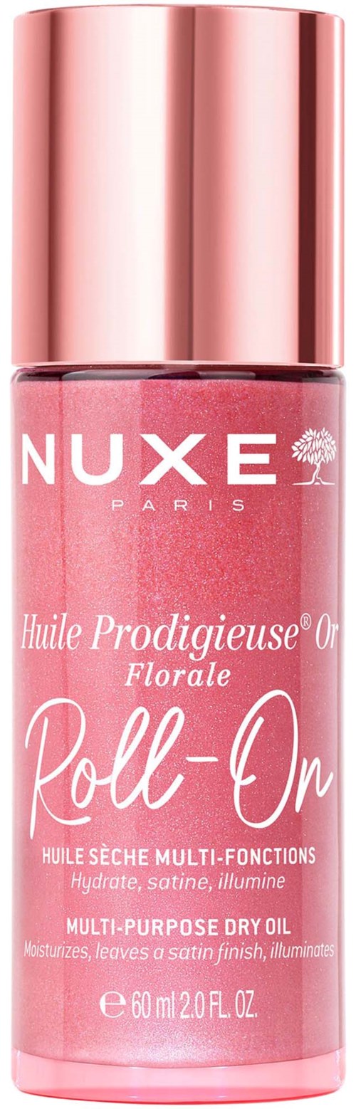 En rosa flaska av Nuxe Blomster torr olja med ett glänsande roséguldslock. Etiketten visar produktnamnet och detaljer.