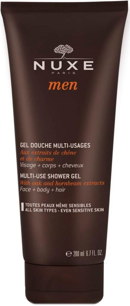 Donkerbruine tube met witte en oranje tekst, die aangeeft dat het Nuxe heren multi-inzetbare douchegel met kamille en honing bevat.