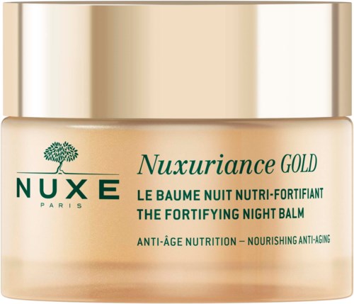 Een kleine pot NUXE Nuxuriance GOLD nachtbalsem, goudkleurige deksel, met groene en zwarte tekst.