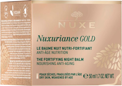 Een doosje NUXE Nuxuriance Gold nachtverzachtende balsem voor droge, verouderde huid, met productdetails in groen en goud.