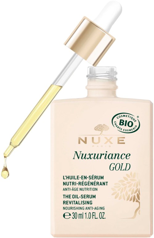 En flaska hudvårdsserum med pipett, märkt Nuxe Nuxuriance Gold, innehållande närande och anti-aging ingredienser.