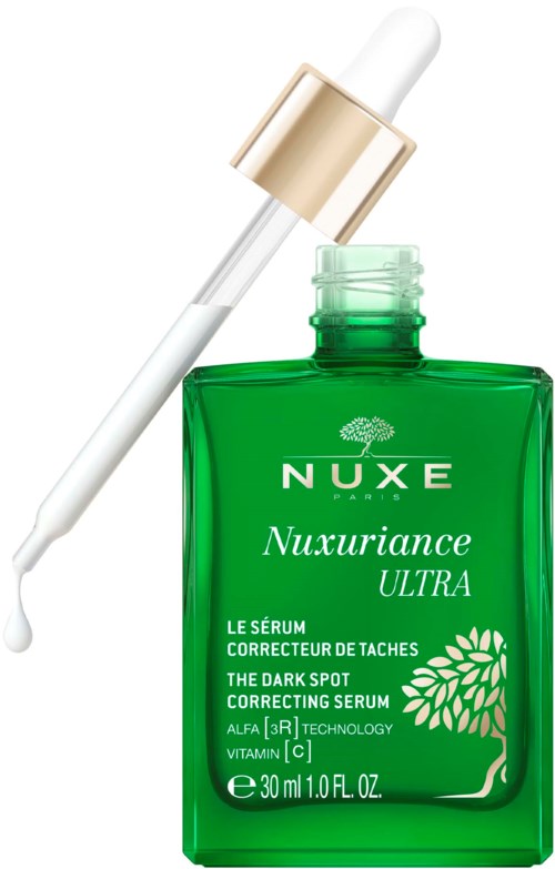 En grön flaska av Nuxe Nuxuriance Ultra mörka fläckar korrigerande serum med en pipett.