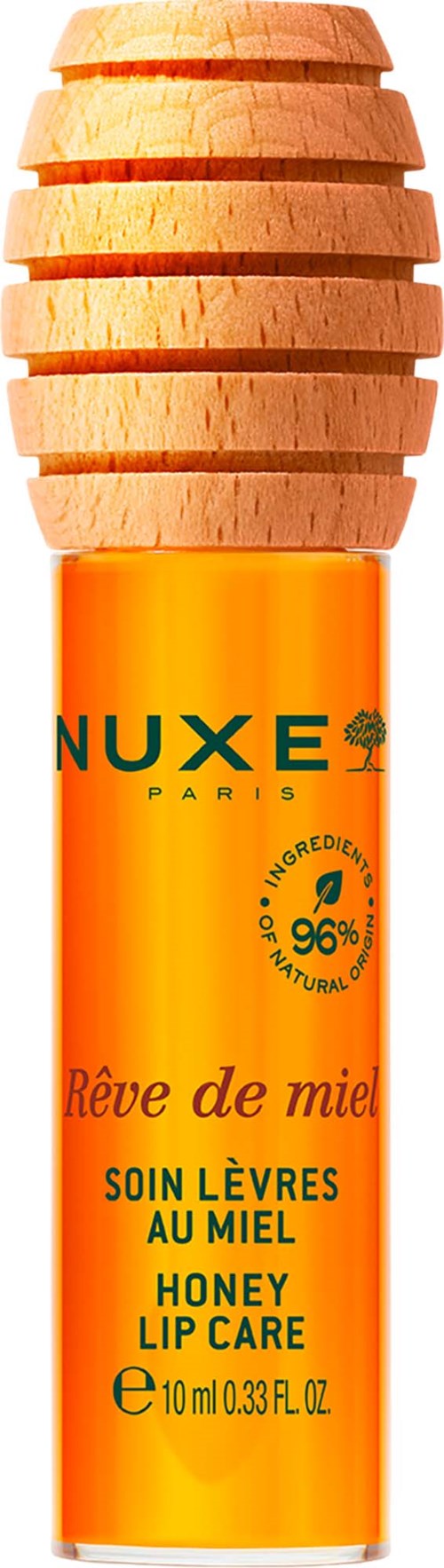 En læbepomade med træhætte og orange beholder mærket NUXE honning læbepflege.