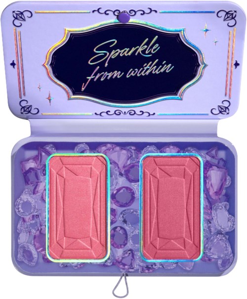 A makeup palette with two pink blushes and a decorative purple case. The case has the words "Sparkle from within" on the lid.