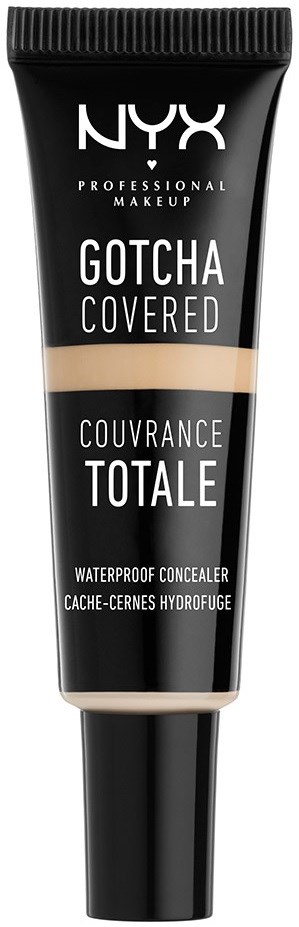 En svart tub med NYX vattentäta concealern 'Gotcha Covered' med beige och svarta etiketter, märkt 'Couvrance Totale.'