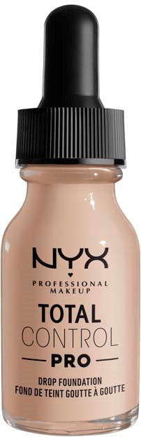 Sävyvoidepullo tipalla, merkintä NYX Total Control Pro, beigen värinen, musta korkki, sileä lasipullo.