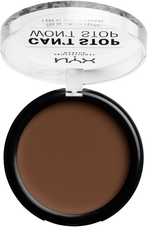 A compact with brown pressed powder, clear lid, and black base, labeled as NYX. It says 'TAMING' on the lid.