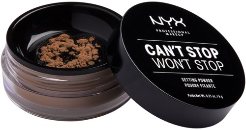 En svart beholder med NYX-innstiltspunkt med åpent lokk, viser løs pudder inni.