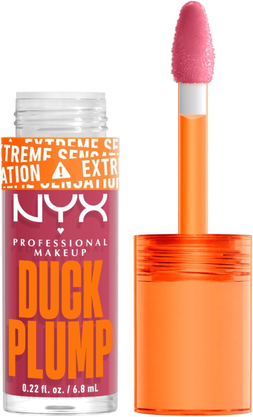 Een tube met NYX professionele make-up met waarschuwingslabel, oranje dop en een roze make-upapplicator.
