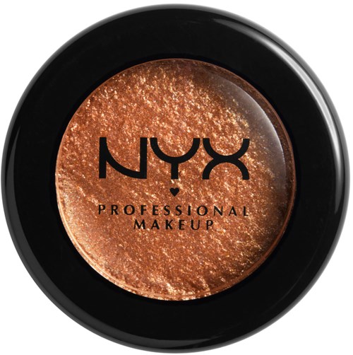 En rund makeup-produkt med glittrande kopparfärgad yta, märkt "NYX PROFESSIONAL MAKEUP" i svart text.