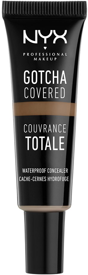 En svart tub med NYX vattentätt concealermedel i beige- och bruna nyanser, märkt "Gotcha Covered."