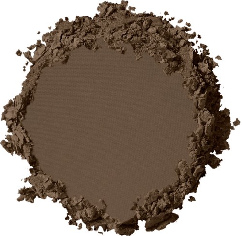 En rund fläck av brunt pulver med något ojämn kant, liknar markkaffe.