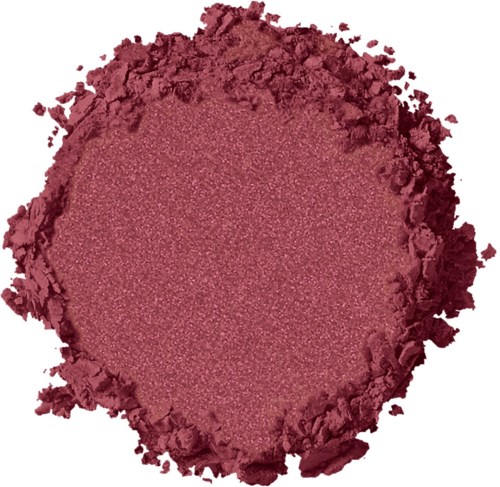 Ett krossat rosa pulver med en slät mitt och grova kanter.