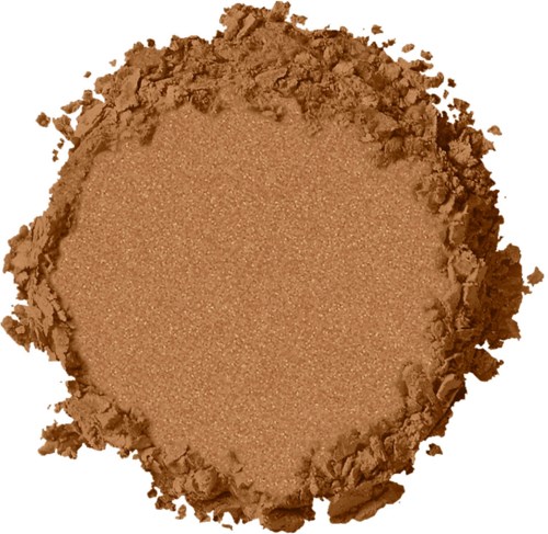 Brun pulver med ojämn, smulig kant, ser ut som makeup eller ansiktspuder.