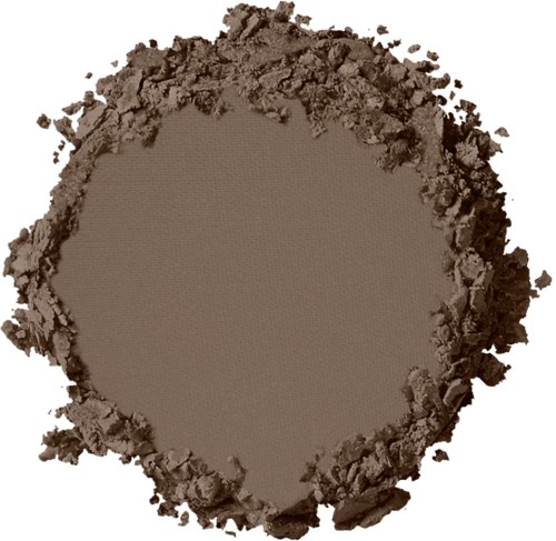 En rund fläck av brunt pulver med en slät mittdel, omgiven av löst, ojämnt utbrett material.