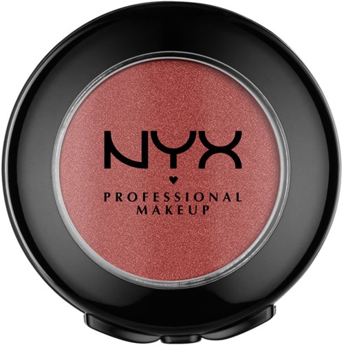 En rund behållare med rosa makeup i svart ytterhölje, märkt 'NYX Professional Makeup.'