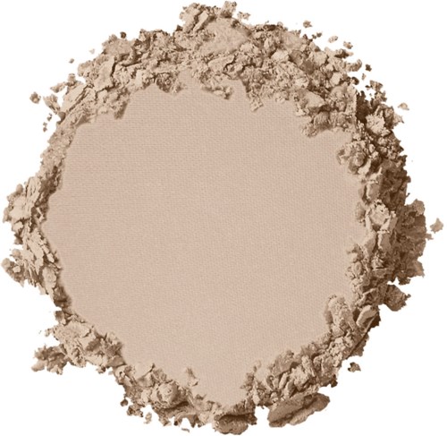 Ett runt område av beige pulver, med ojämna, skrovliga kanter runt cirkeln.