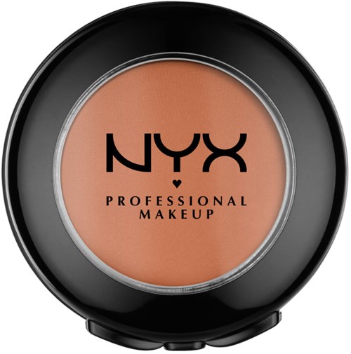 A round container of NYX professional makeup with beige powder inside, black lid, and label with logo and text.