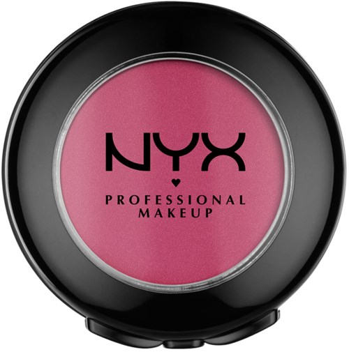 Ett runt rosa sminkprodukt i en svart behållare med svart text, "NYX PROFESSIONAL MAKEUP."